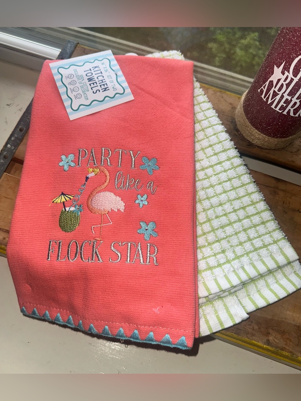 Party Like a Flock Star" embroidered kitchen towel set features a pink flamingo